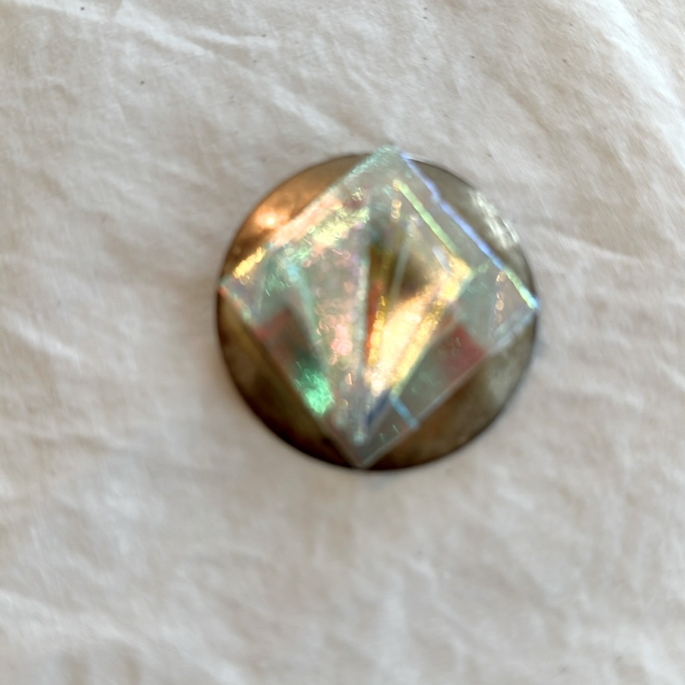 Multicolor stone on sterling pendant. Can be placed on chain or used as broach.